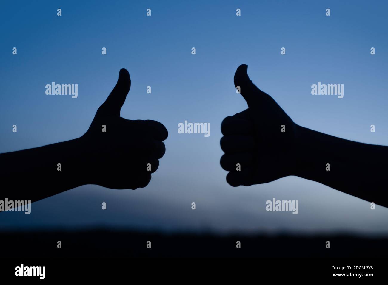Thumbs up. Agree. Accept. Gesture. Man shows thumbs up. Thumbs up silhouette Stock Photo