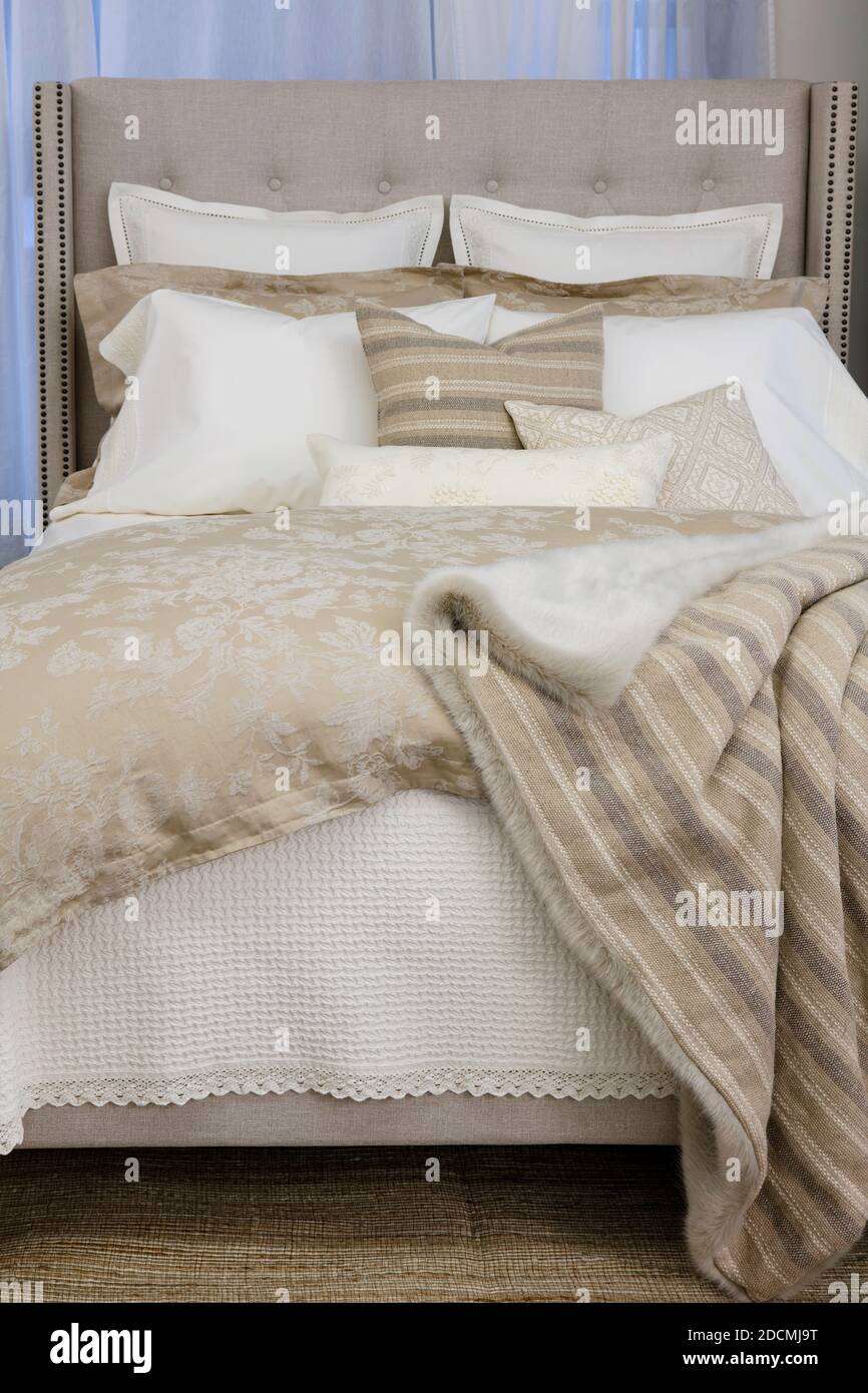 Bed with luxurious covers and pillows Stock Photo Alamy