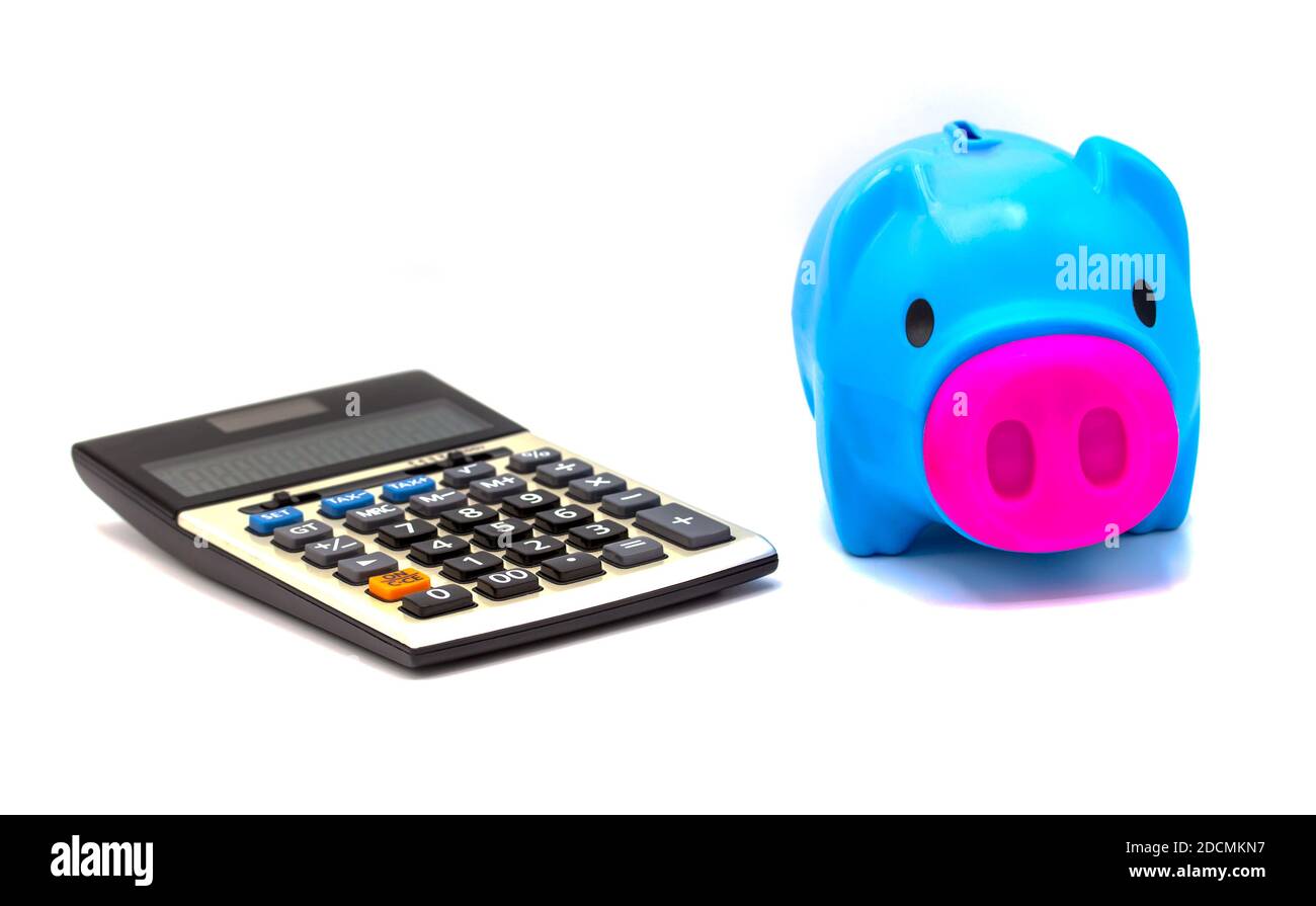 Calculator with piggy bank on white background Stock Photo - Alamy