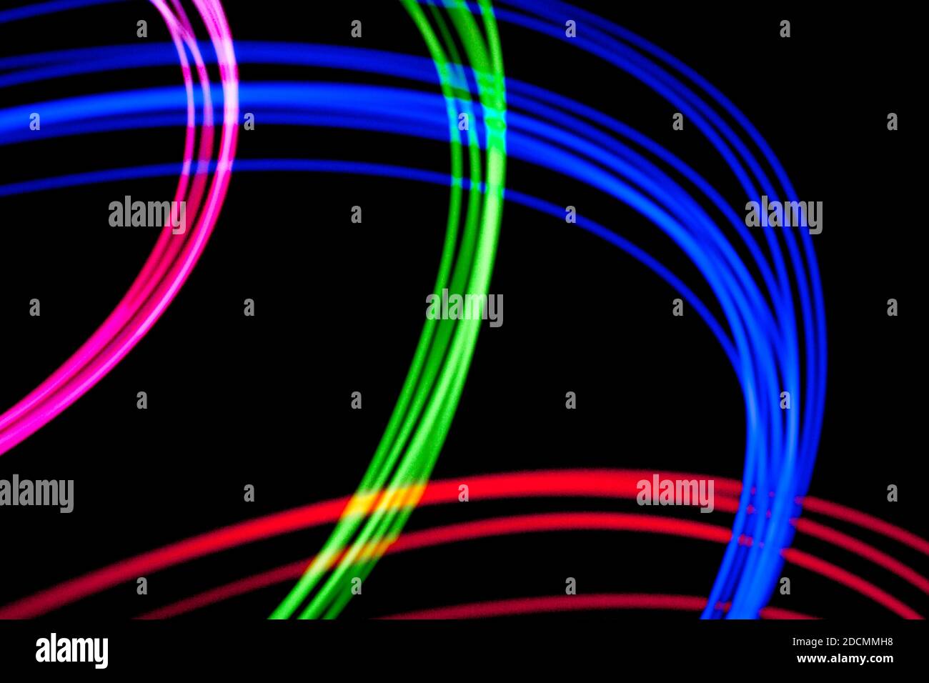 Electronic neural sygnals visualised as light traces on isolated black background. Neat backdrop for technology, computing, and data science Stock Photo
