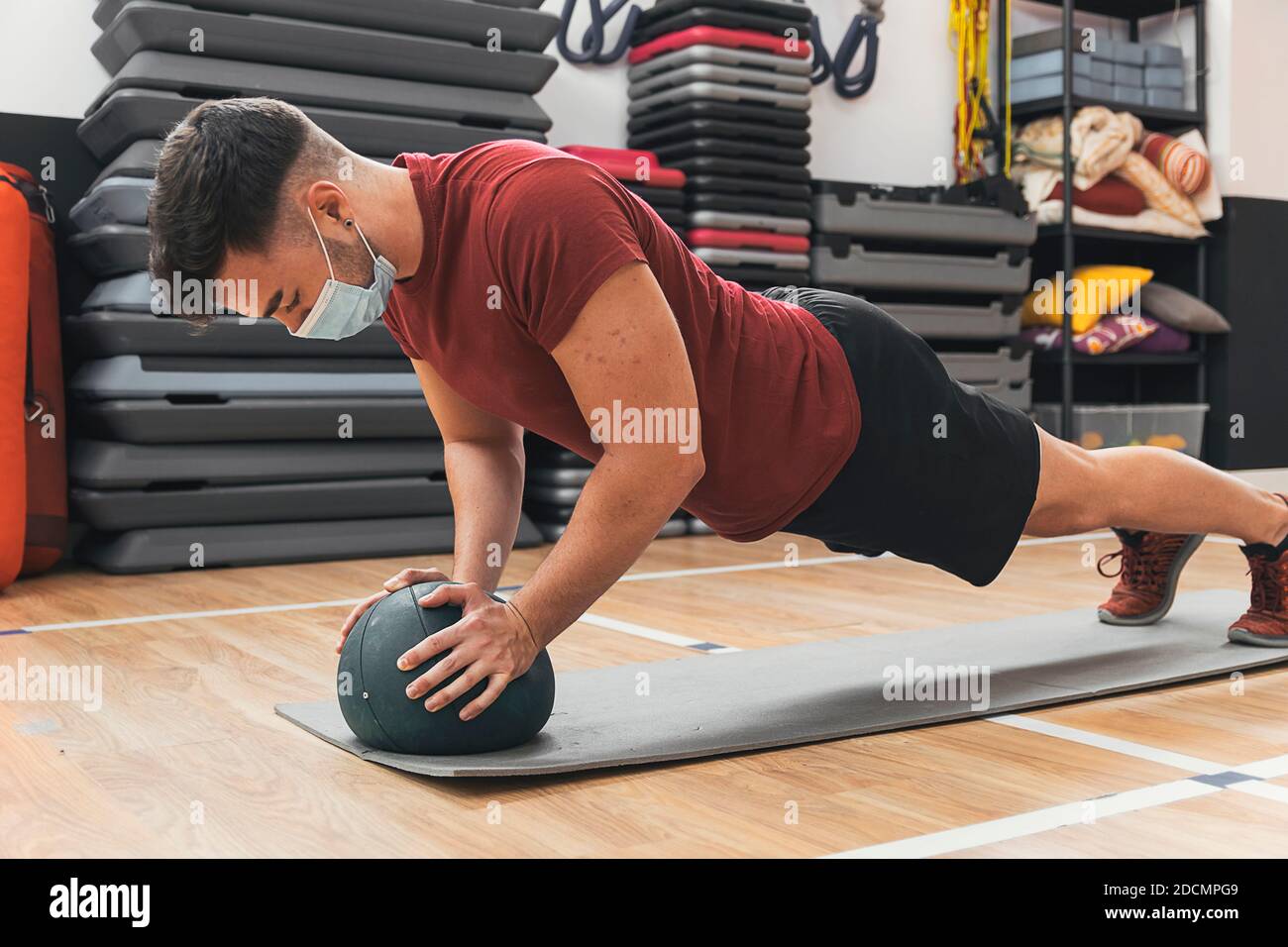 boy exercising with ball in the gym Stock Photo Alamy