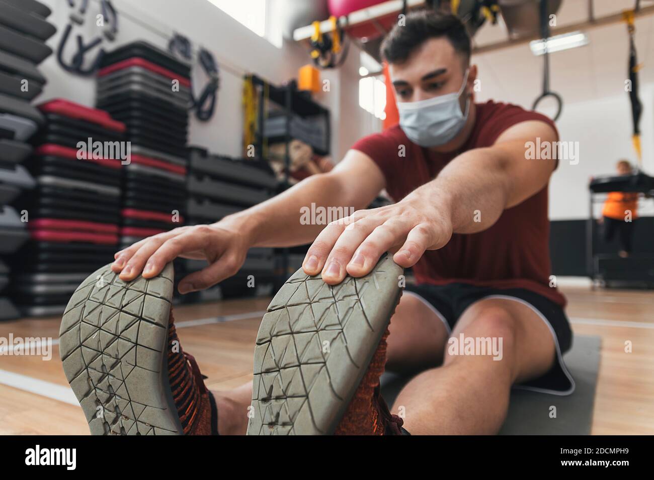 Guy stretching ball hi-res stock photography and images - Alamy