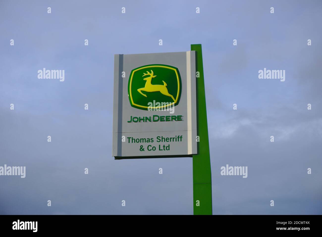 Sign outside the Thomas Sherriff & Co John Deere dealership near Coldstream, Berwickshire, Scottish Borders, UK. Stock Photo