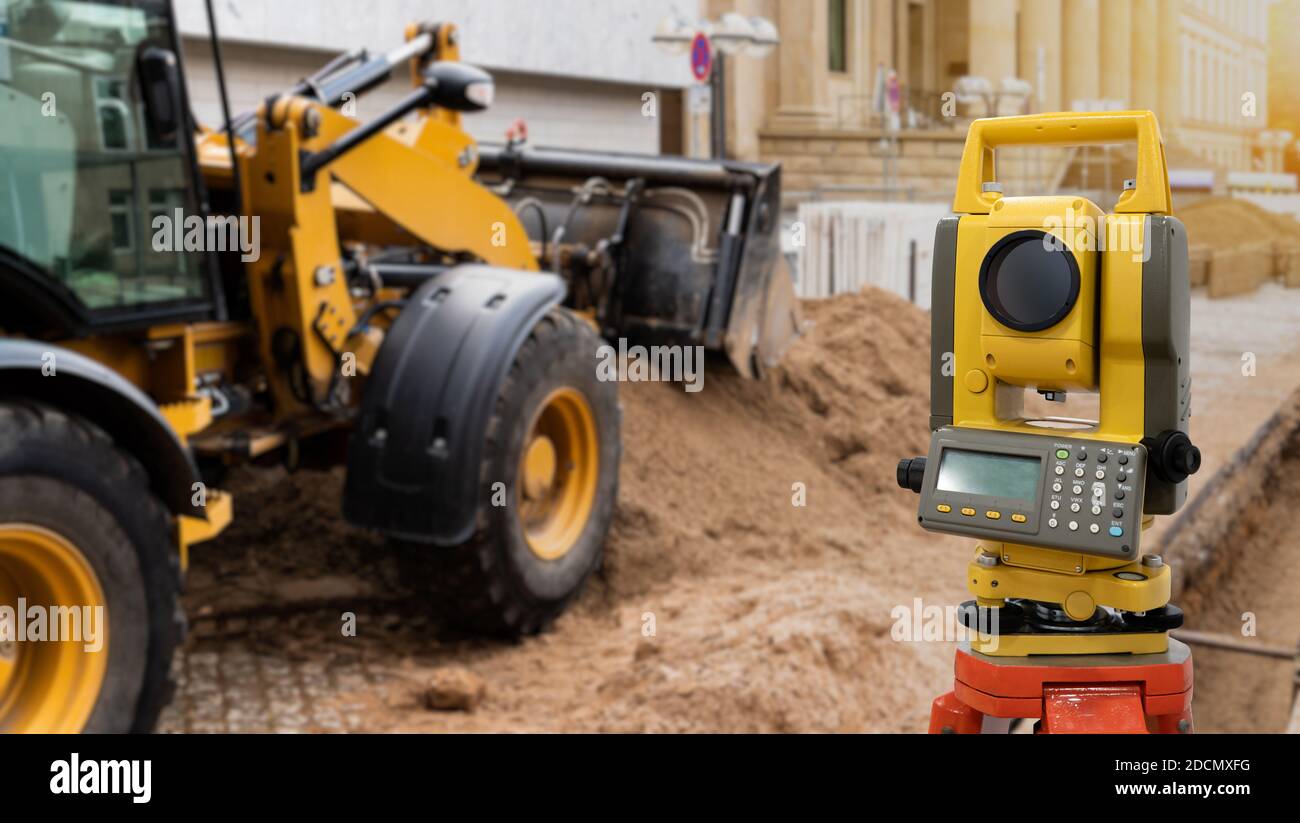 Theodolite, total positioning station, on a background of road construction Stock Photo