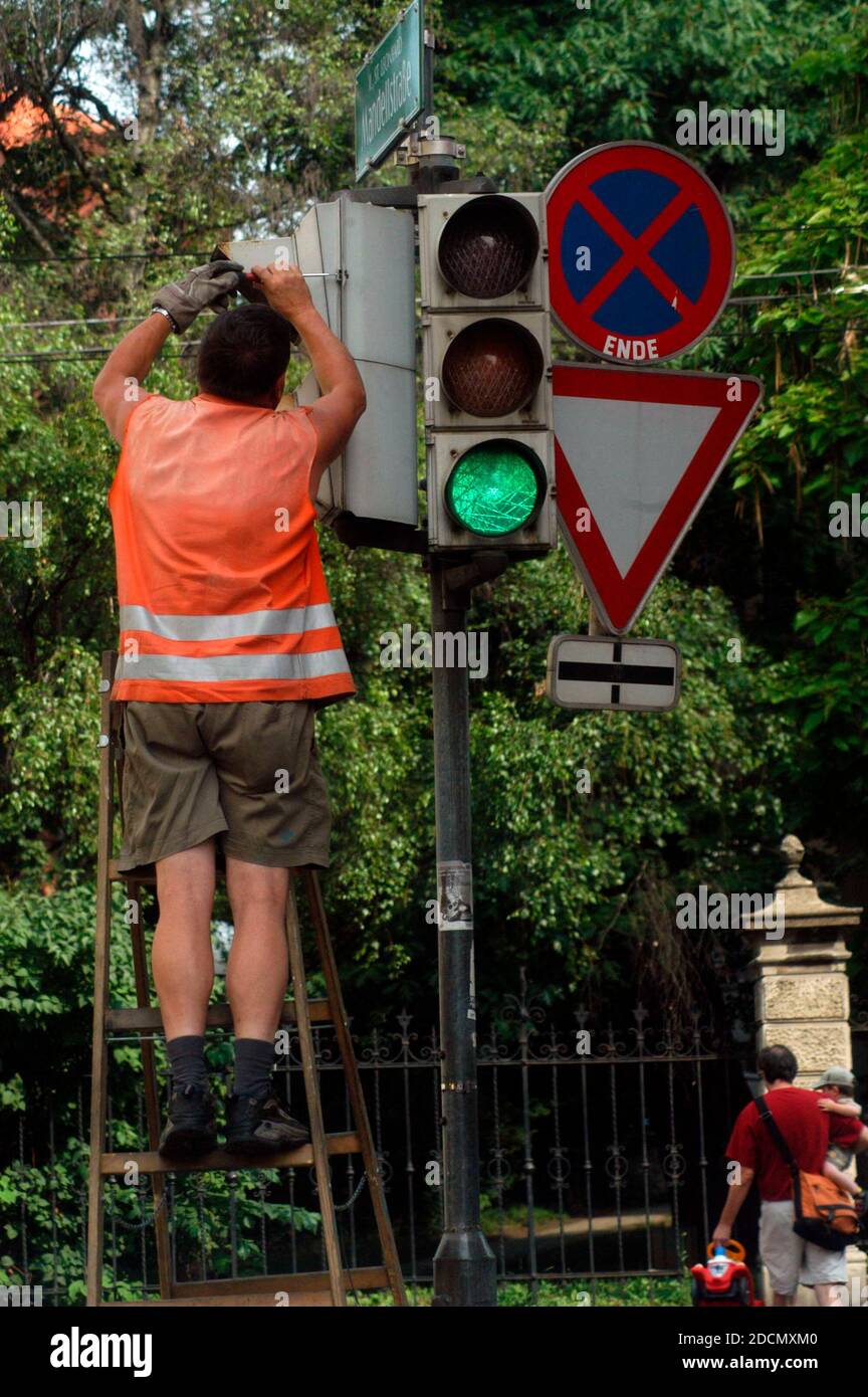 assembly and repair of a traffic light system on the street Stock Photo