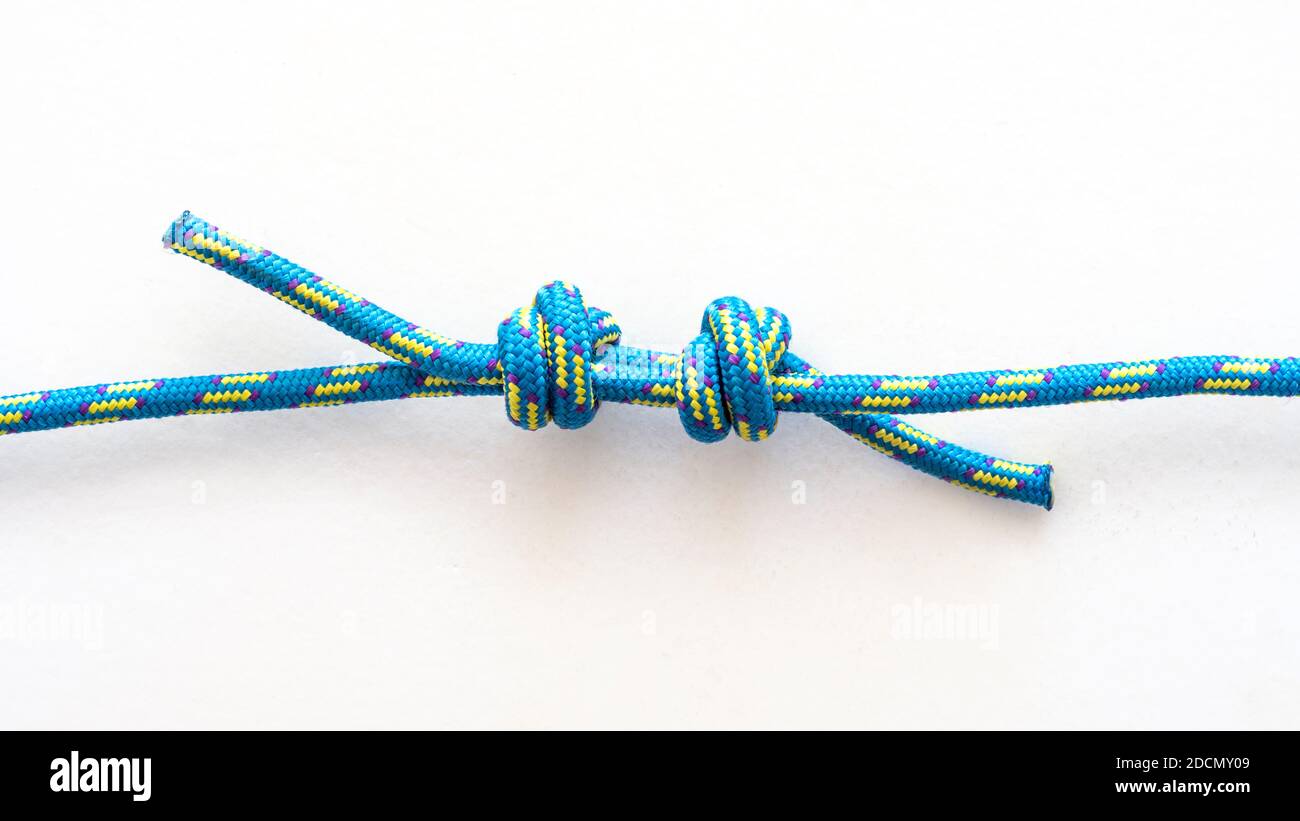 Double fisherman's bend knot pulled loose on a white background Stock Photo