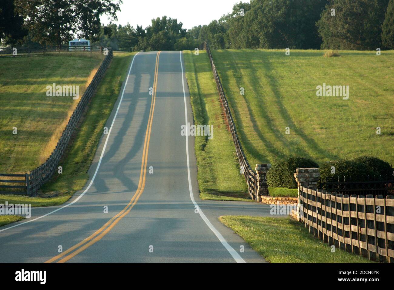 A two-lane divided road in Virginia's countryside, USA Stock Photo