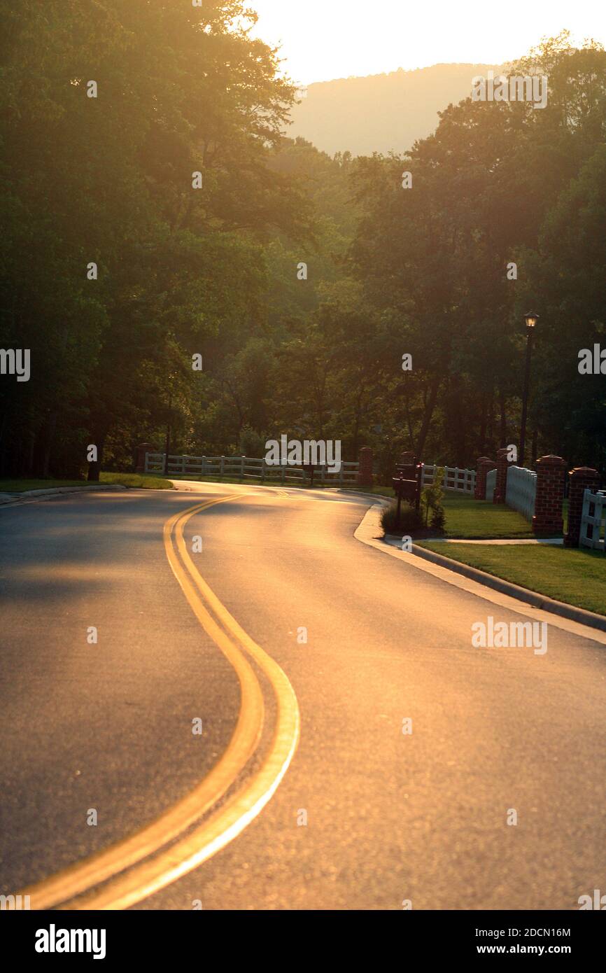 A two-lane divided road in rural Virginia, USA Stock Photo