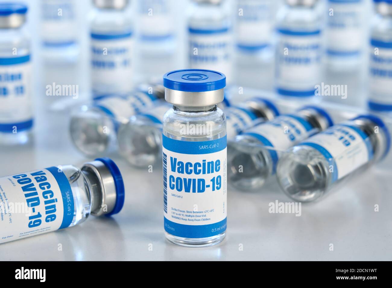 Covid 19 vaccine vial bottles, corona virus cure manufacturing production. Stock Photo
