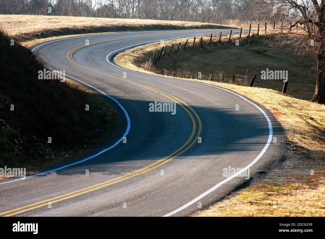 Curving divided road in Virginia's countryside, USA Stock Photo