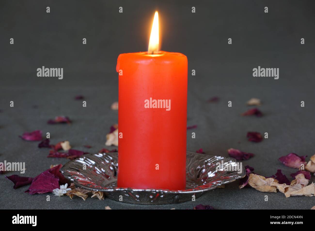 candle and dried rose Stock Photo