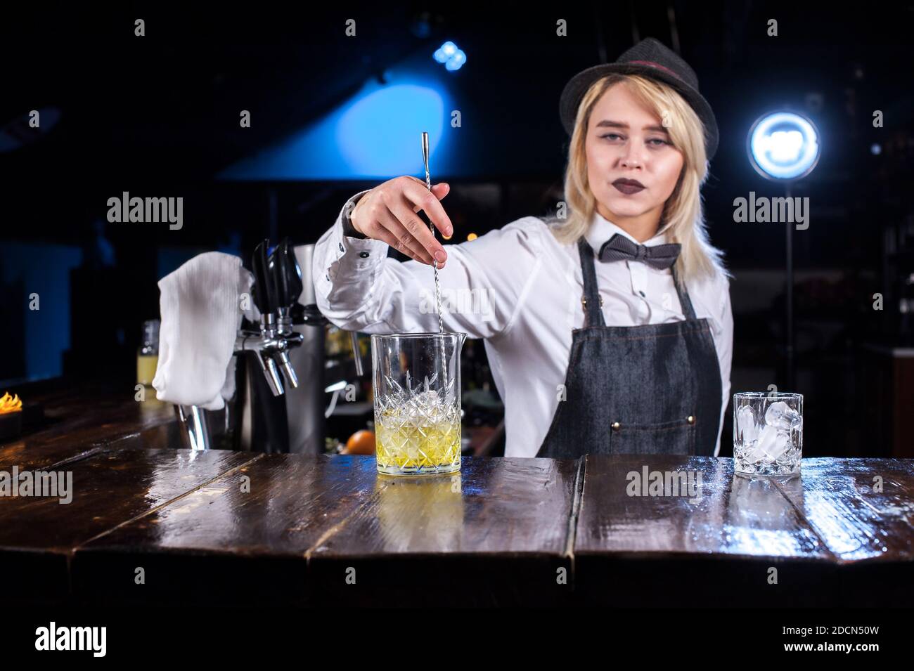 Girl bartender creates a cocktail in the taproom Stock Photo