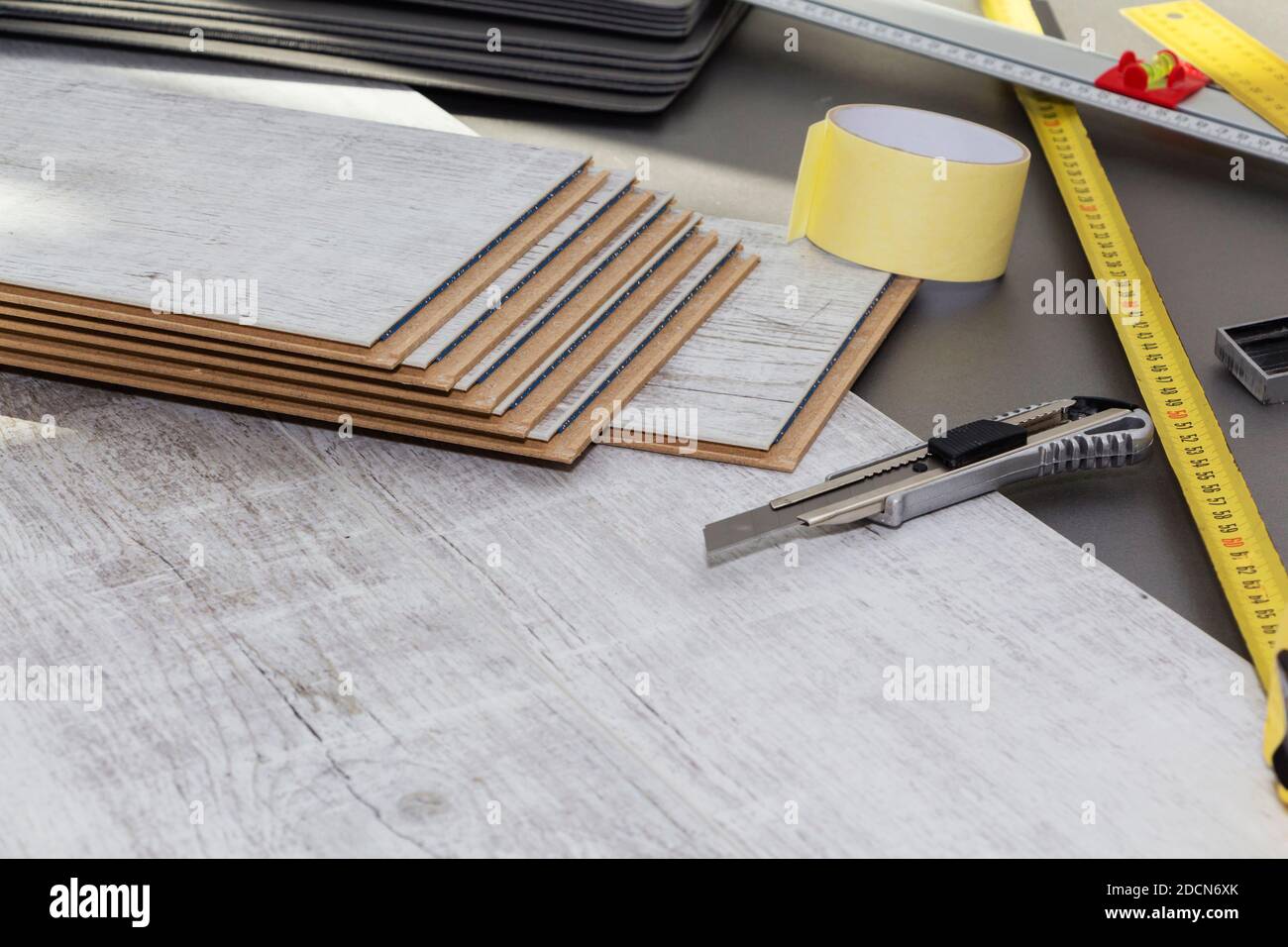Planks of laminate floor and tools to install them Stock Photo Alamy