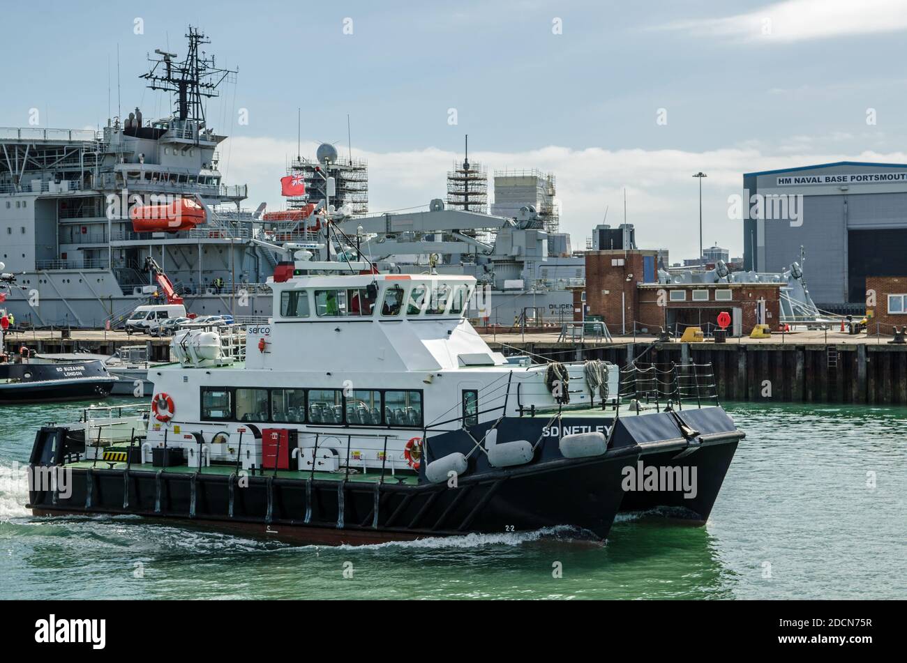 Portsmouth, UK - September 8, 2020: The passenger tender SD Netlet heading away from the quayside to pick up passengers from one of the Royal Navy shi Stock Photo