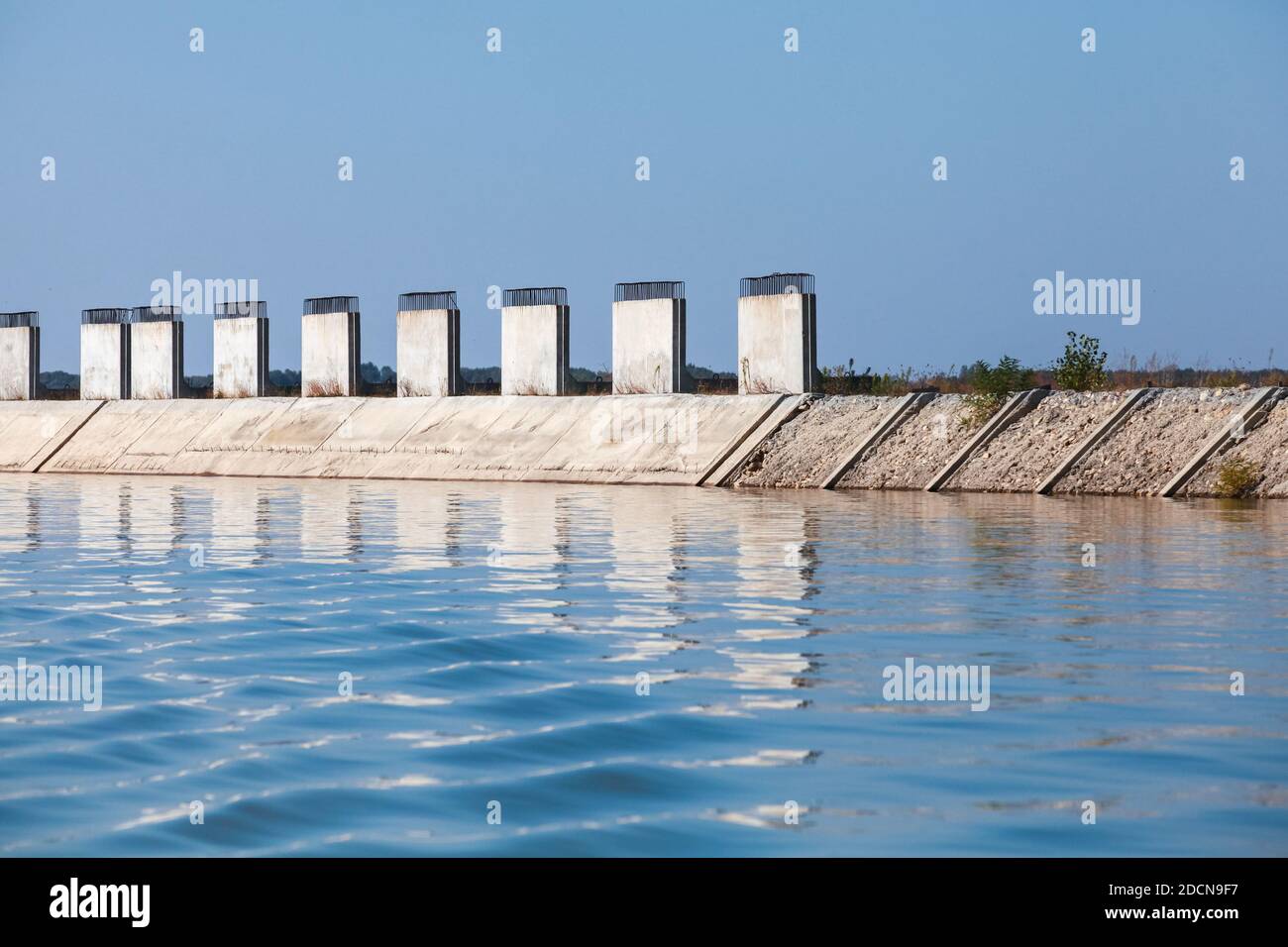 Coastal protection structure made of white concrete blocks mounted at Danube river coast, Ruse, Bulgaria Stock Photo