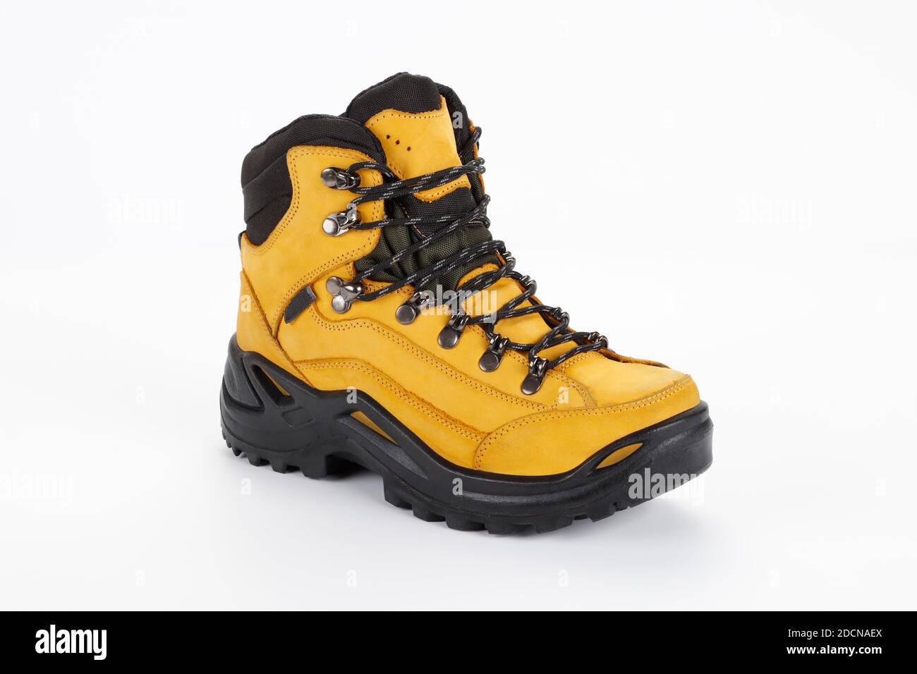 yellow hiking boots on white background Stock Photo