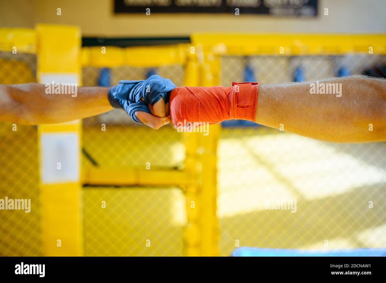 Male MMA fighters hands with red and blue bandages Stock Photo