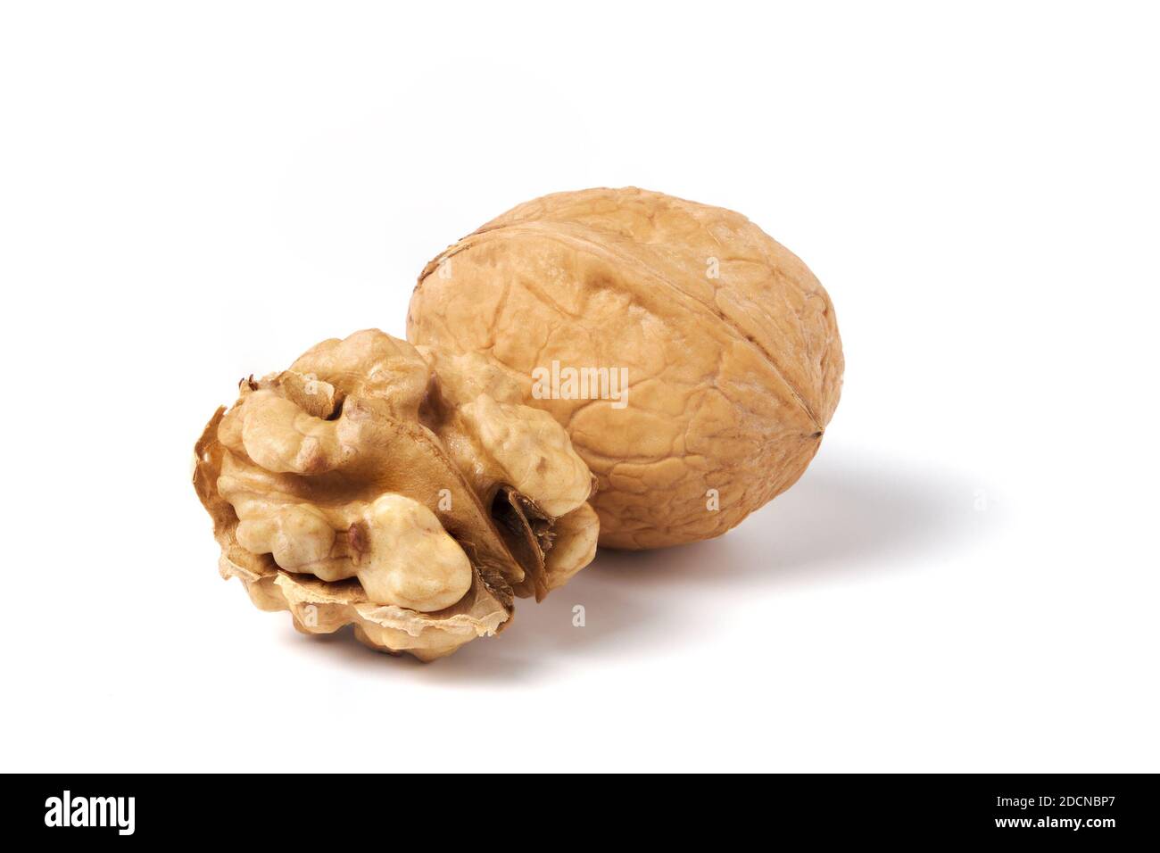 Walnut without nutshell and nutshell walnut isolated on white Stock Photo