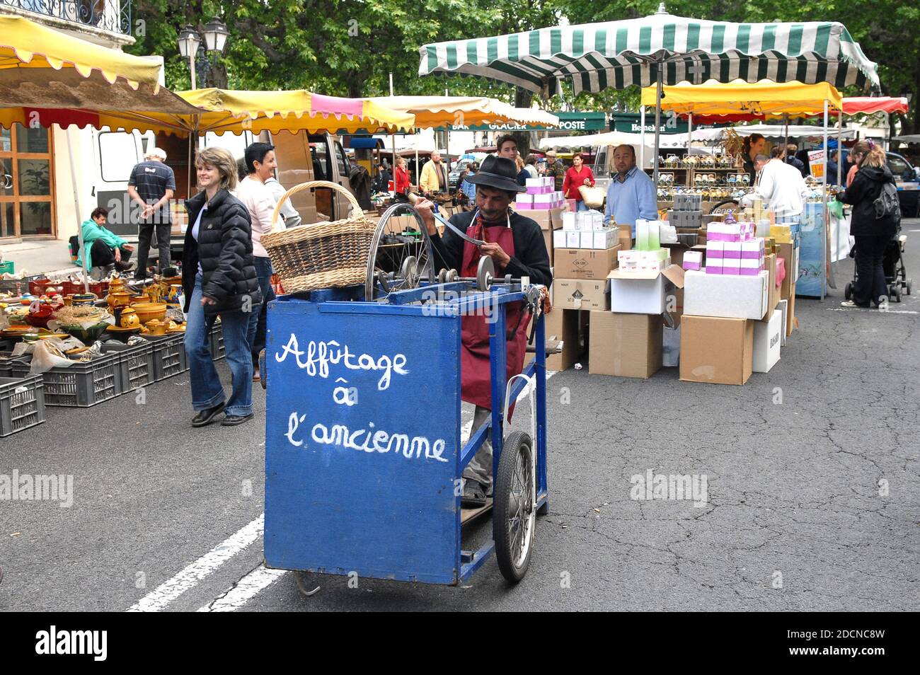 Old fashioned knife sharpening man in market France 2007. PICTURE BY