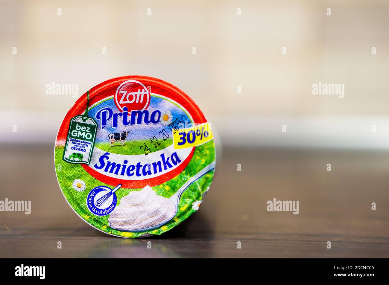 POZNAN, POLAND - Nov 21, 2020: Polish Zott Primo cream with 30 percent fat  in a cup on a wooden table in soft focus background Stock Photo - Alamy