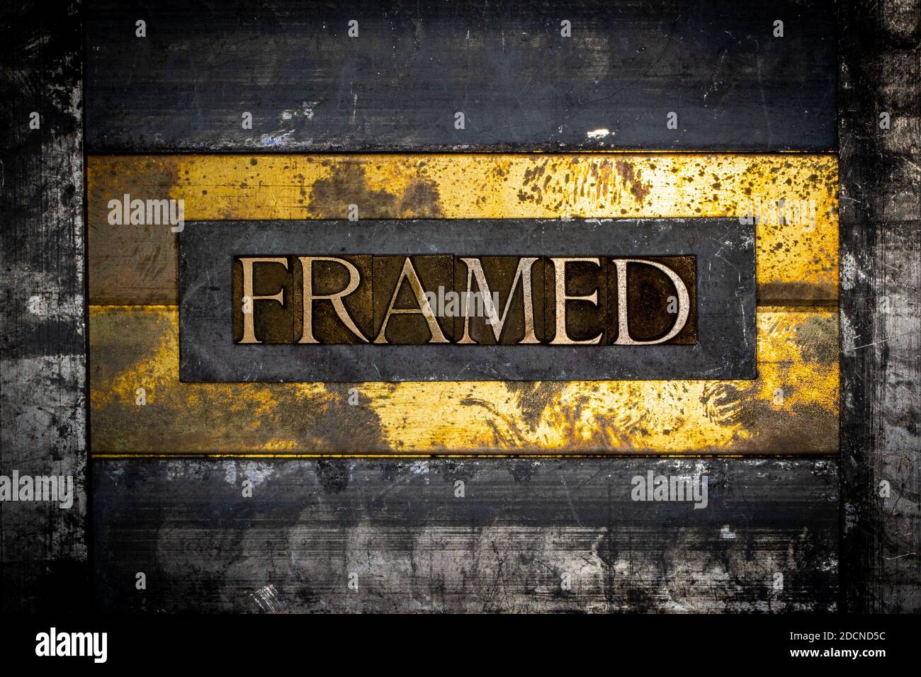 Framed text on textured lead with grunge copper and vintage gold background Stock Photo