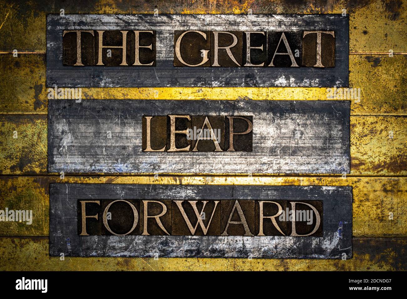 The Great Leap Forward text message on textured grunge copper and vintage gold background Stock Photo