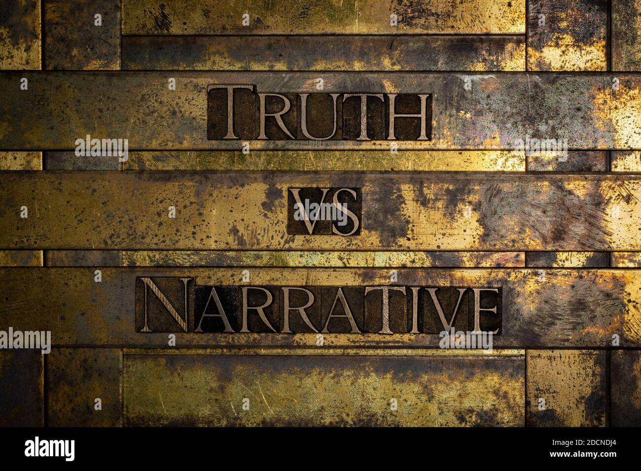 Truth Versus Narrative text message on textured grunge copper and vintage gold background Stock Photo