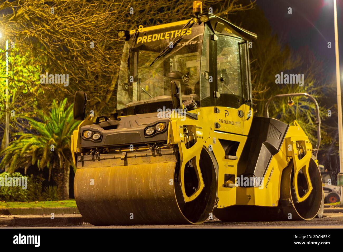 Bomag roller, road construction heavy machinery at night Stock Photo