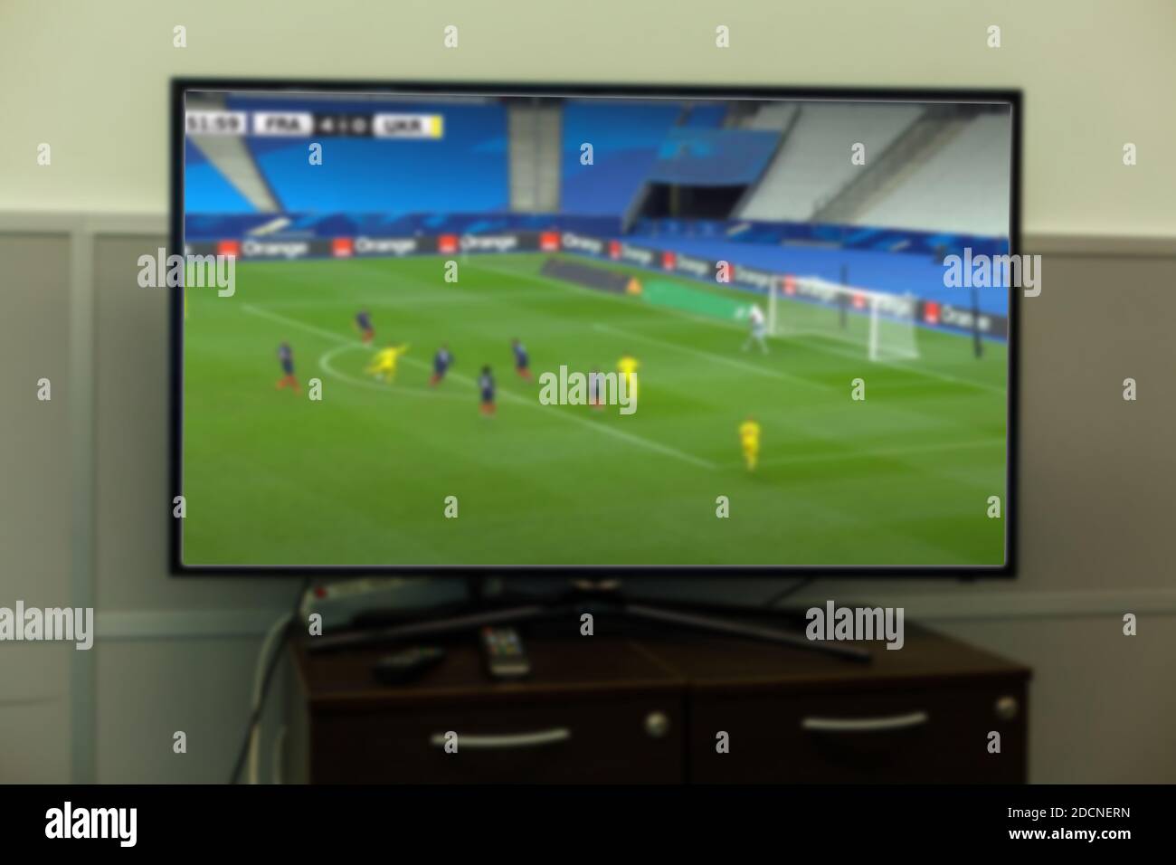 football match football on the big screen tv Stock Photo