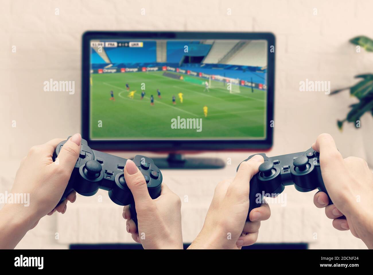 hands with joystick play football Stock Photo - Alamy