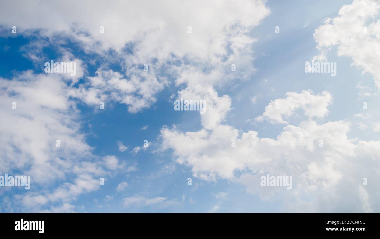 Light blue sky with beautiful natural white fluffy clouds Stock Photo ...