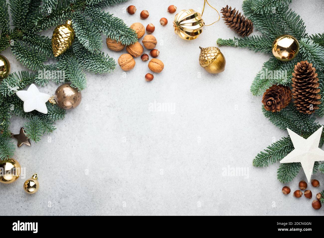 Christmas Or New Year Frame Background Made Of Fir Tree Branches, Pine Cones And Christmas Toys. Trendy Modern Christmas Decorations Frame. Design Moc Stock Photo