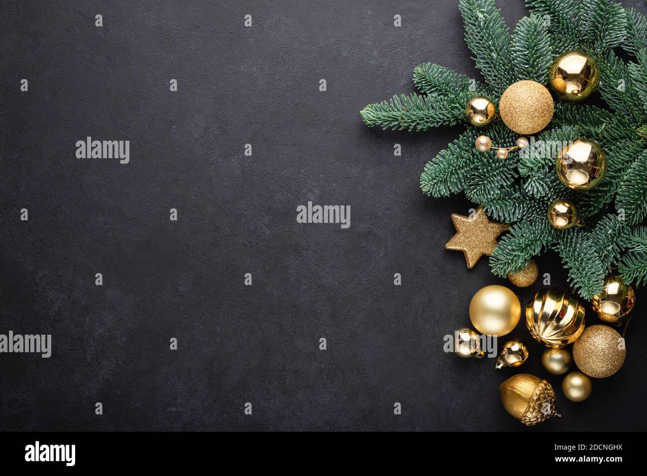 Christmas Background Fir Tree Golden Toys On Black Concrete Background With Copy Space For Text, Design Elements, Greeting Stock Photo