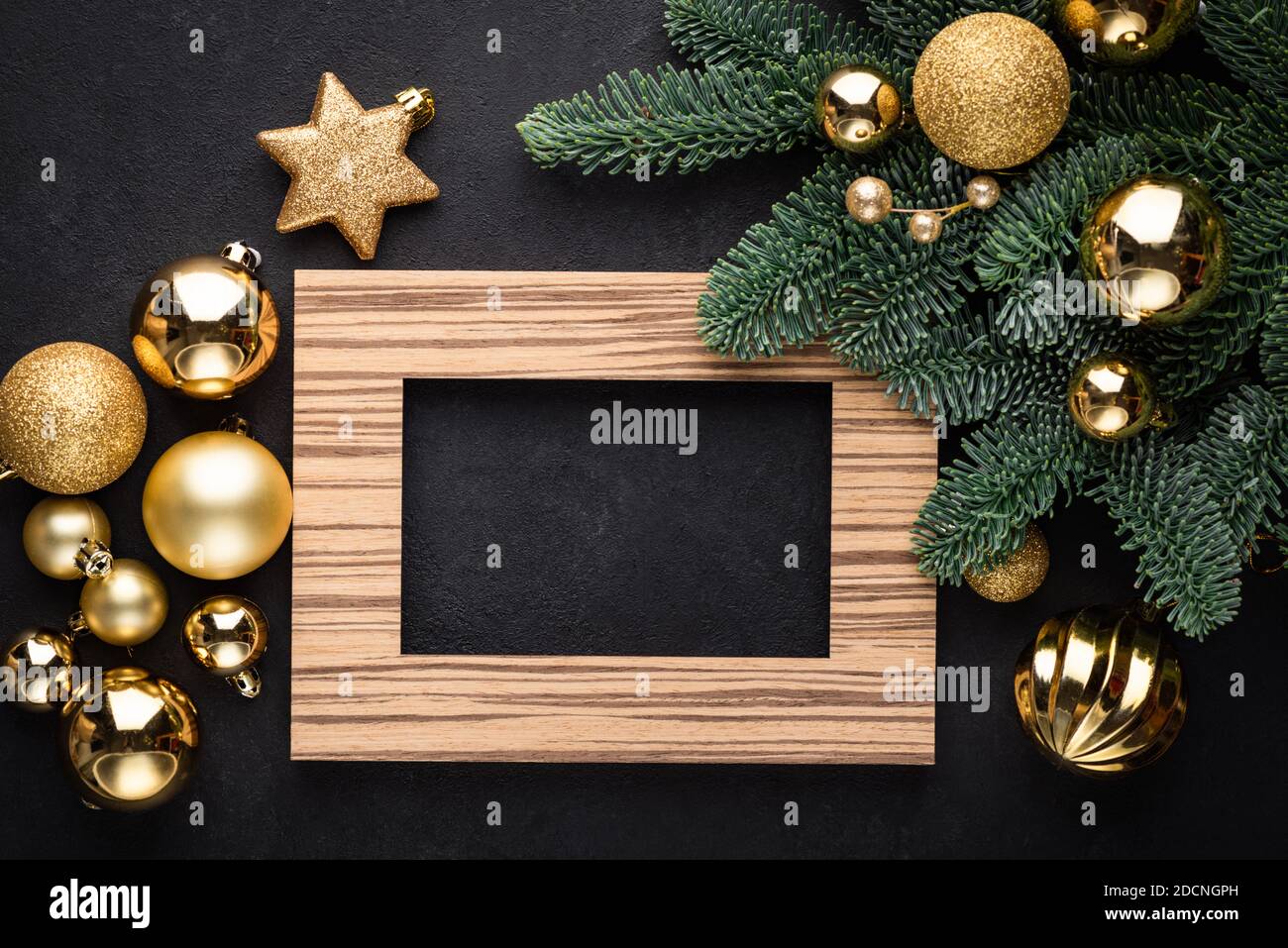 Empty Photo Frame Christmas New Year Background Over Black Concrete Backdrop. Gift Card Greeting Design Mock Up Stock Photo