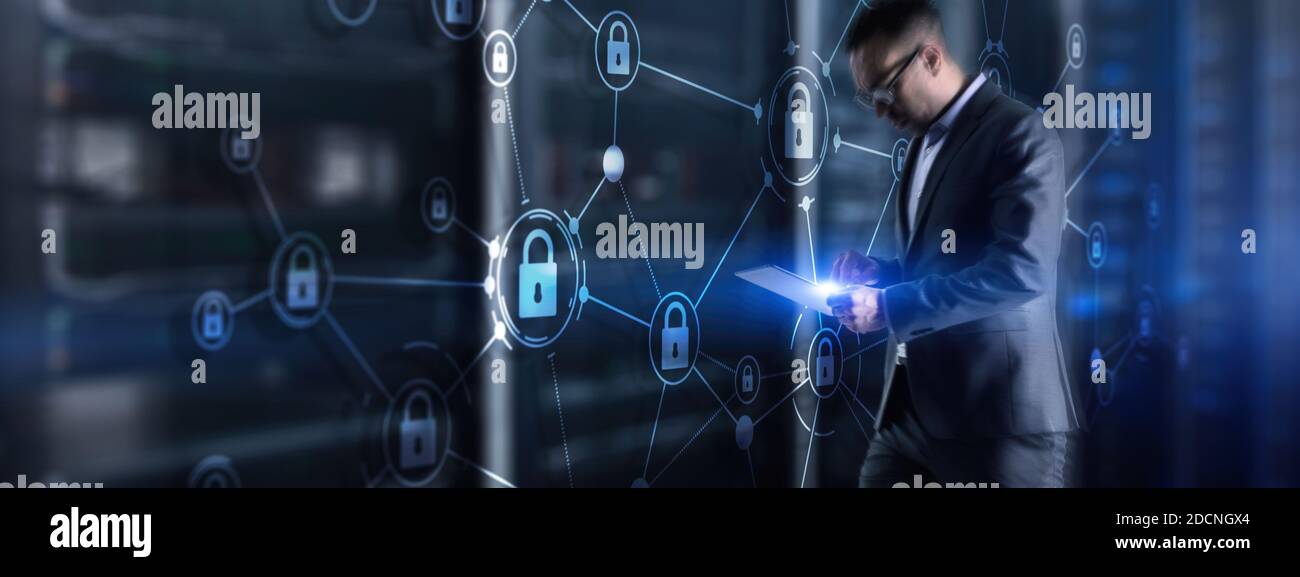 Security data protection concept. Businessman protecting data personal information on tablet and virtual interface. Stock Photo