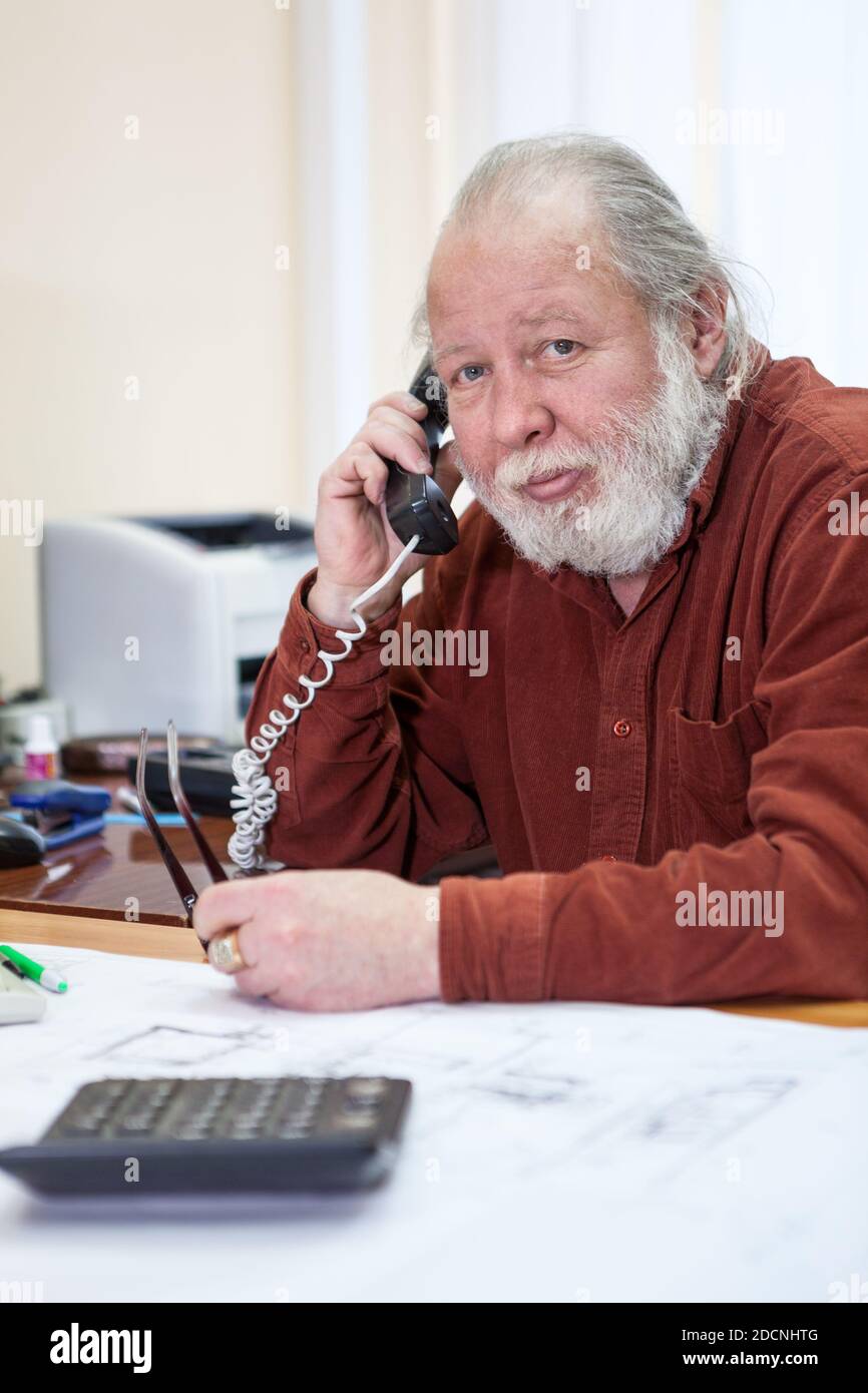 Calm senior manager calling by telephone in office room, white beard and hair, looking at camera, one person Stock Photo - Alamy Calm senior manager calling by telephone in office room, white beard and hair, looking at camera, one person Stock Photo - Alamy