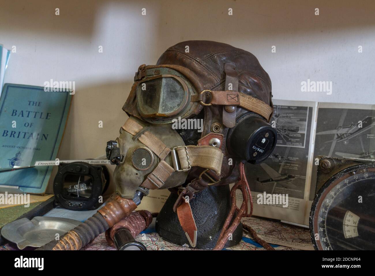 A WWII helmet, oxygen mask and goggles on display in the Lincolnshire Aviation Heritage Museum, East Kirkby, Spilsby, Lincs, UK. Stock Photo