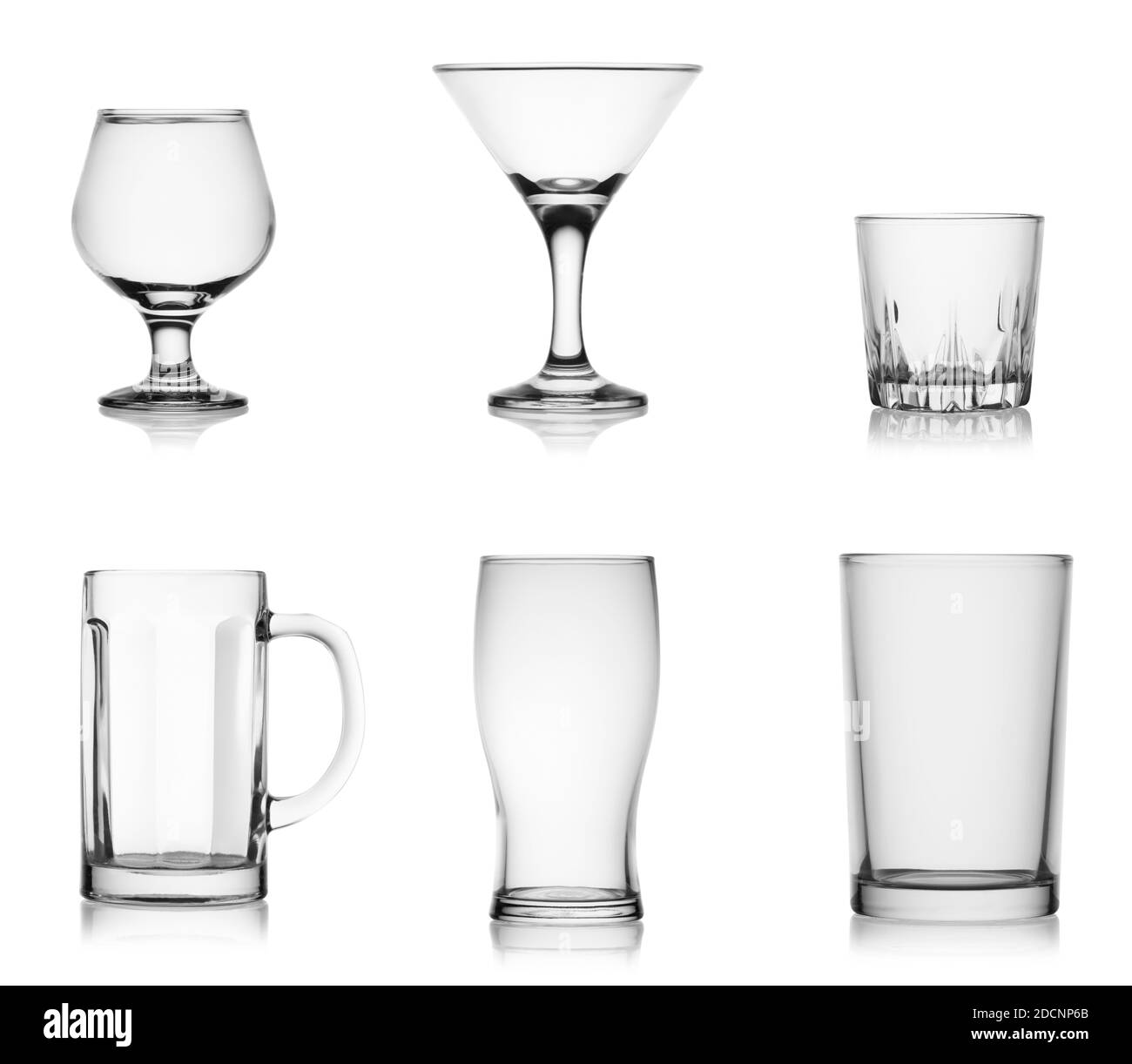 Collectible set of empty glassware glasses isolated on white background. Glasses for various alcoholic beverages. Stock Photo