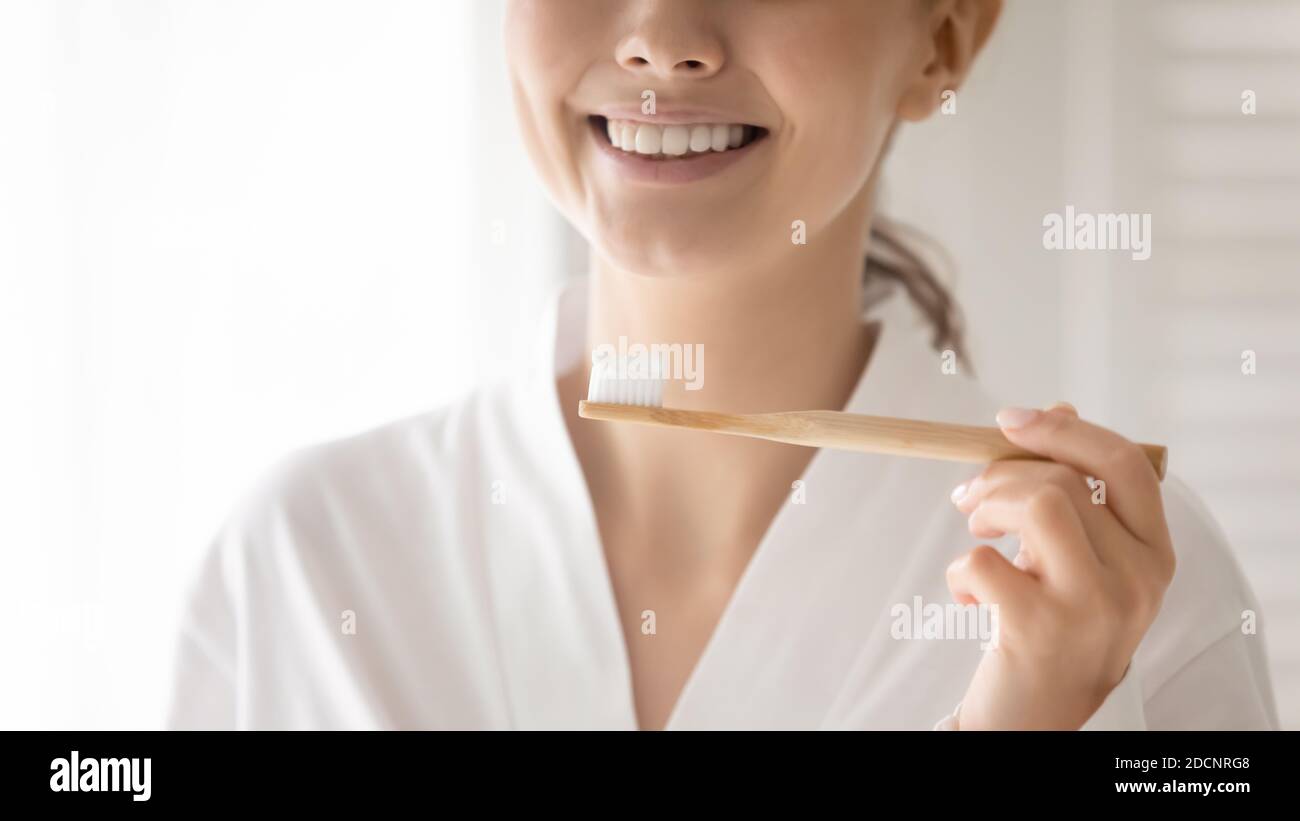 Young woman holding brush and paste preparing to clean teeth Stock Photo