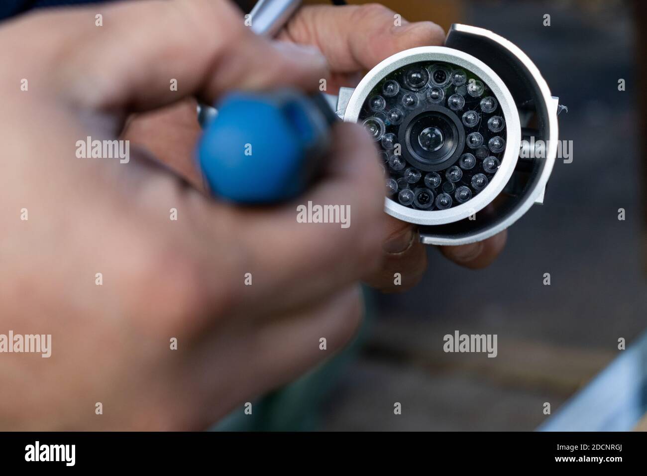 Professional who repairs and installs the surveillance camera Stock ...