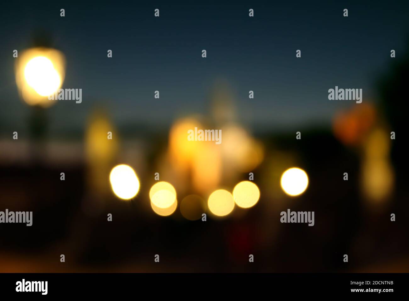 Blurred lights of night city. Blurred background with night city with colorful bokeh. Stock Photo