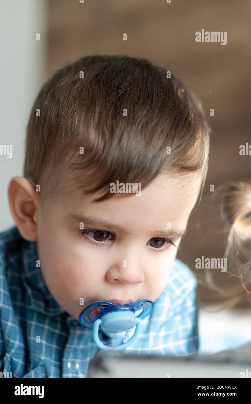 Childhood, family, loneliness concepts Little preschool black boy in