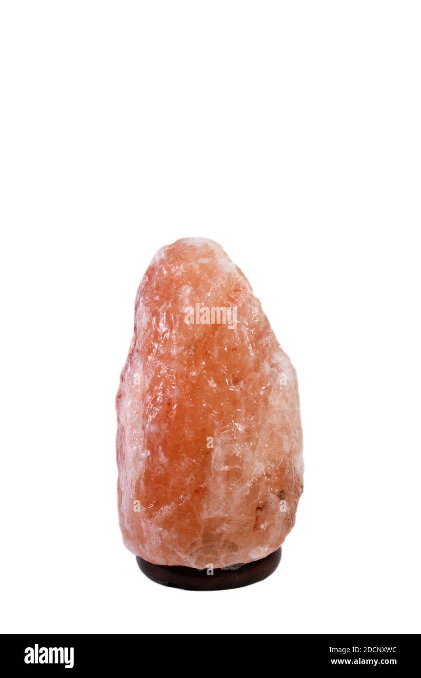 Himalayan Salt Lamp on white background in vertical. Stock Photo