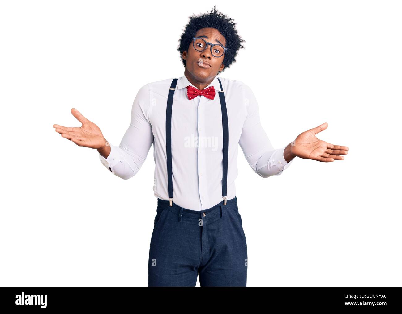 Handsome african american man with afro hair wearing hipster elegant look clueless and confused expression with arms and hands raised. doubt concept. Stock Photo