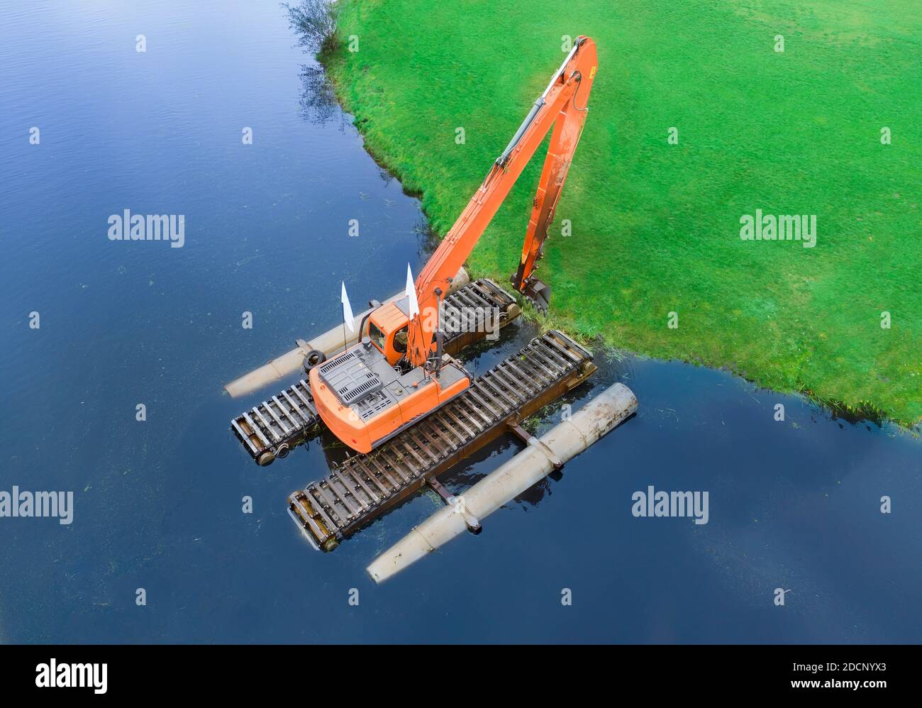 Excavator digging water mud construction hires stock photography and