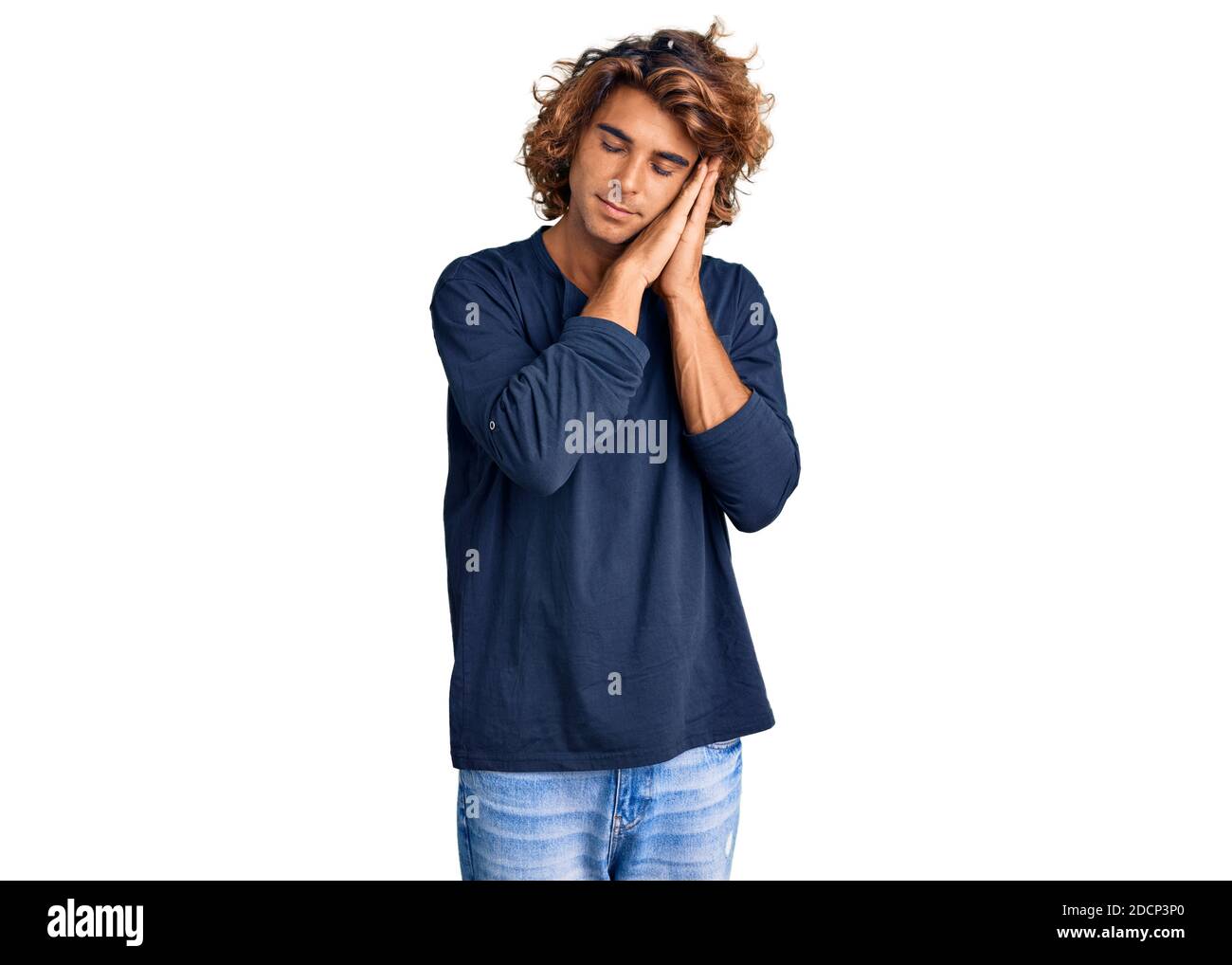 Young hispanic man wearing casual clothes sleeping tired dreaming and ...