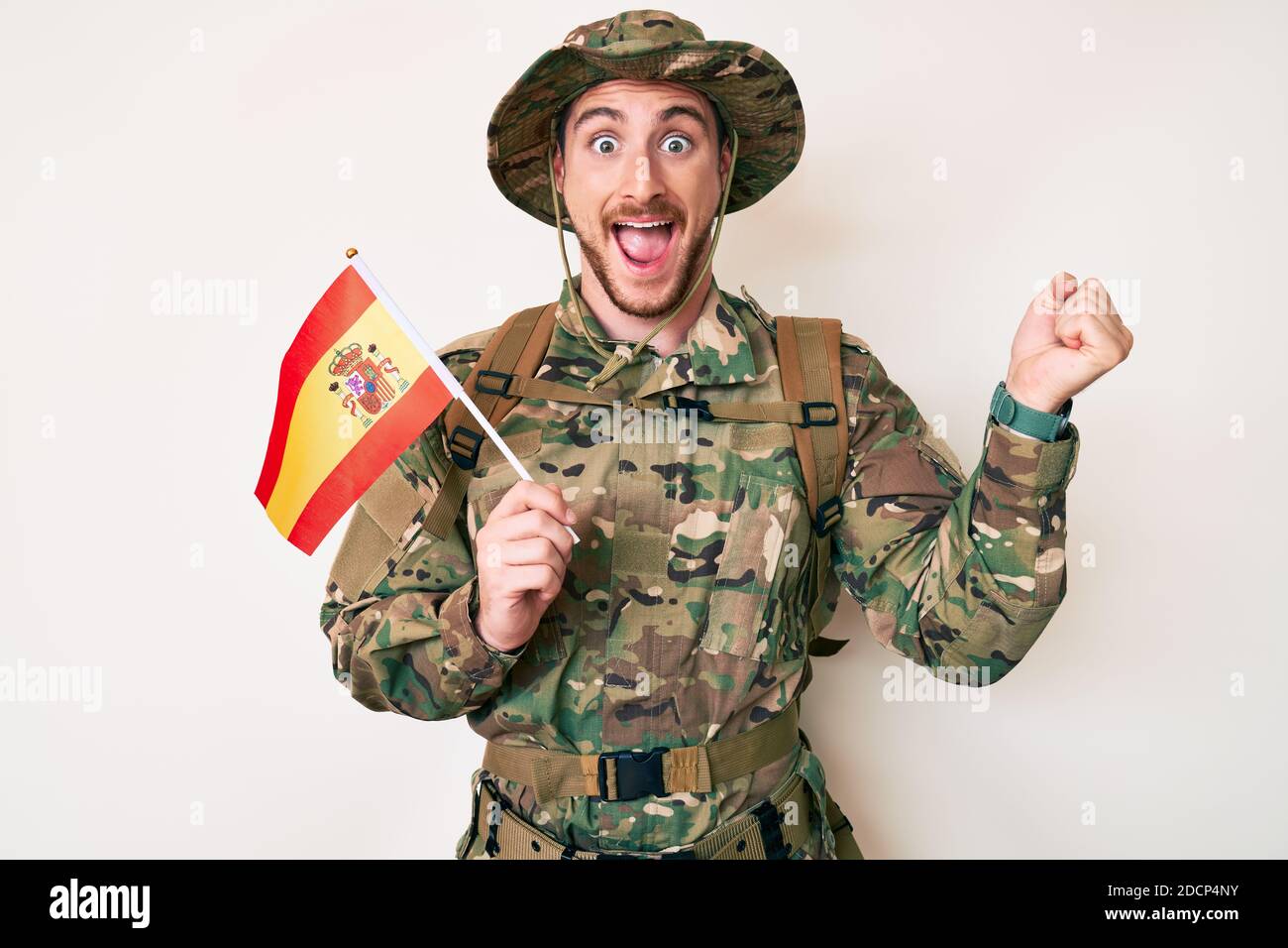 Young Caucasian Man Wearing Camouflage Army Uniform Holding Spanish 