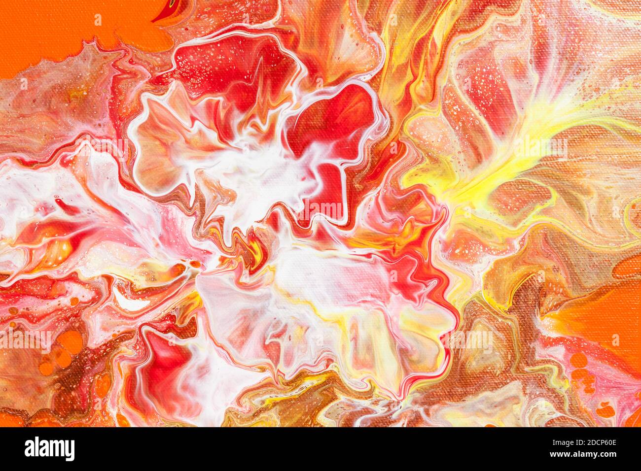 Freakish colorful stains of liquid paint. Orange fluid art abstract background Stock Photo