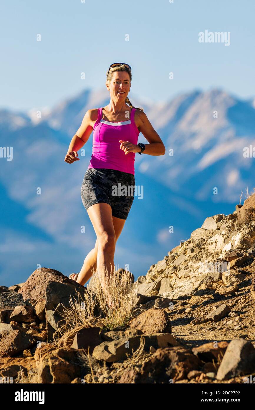 Attractive fit woman running on mountain trails; Salida; Colorado; USA Stock Photo