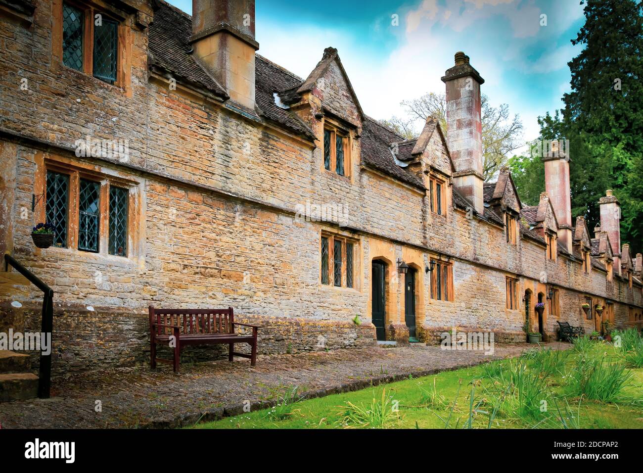 A historical architectural gem, the Helyar Almshouses, constructed of local Ham-stone in 1640-60, in the village of East Coker, Somerset, England. Stock Photo